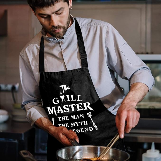 Rosoz Funny Aprons for Men - The Grill Master, The Man The Myth The Legend - Cooking Grilling BBQ Chef Apron for a Husband, Dad Gifts, Waterproof Oil Proof Black Apron with 2 Pockets